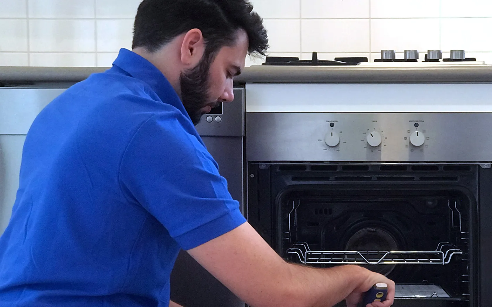 Professional cleaner detailing an oven during an end of lease clean